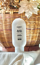 Load image into Gallery viewer, Black Velvet hand lotion displayed with warm fall décor.