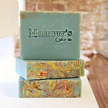 Load image into Gallery viewer, Bars of green soap embossed with 'Mammy's Soap Co' on a white and wood surface