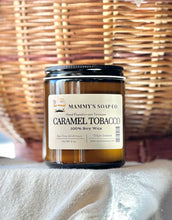 Load image into Gallery viewer, Caramel Tobacco soy candle displayed with warm fall décor.