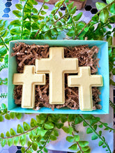 Load image into Gallery viewer, Box of three cross bath bombs in a gift box on a greenery background
