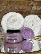 Load image into Gallery viewer, Two jars labeled Mammy's Soap Co Dreamcatcher Sugar Body Polish on a mirrored surface with white towels.
