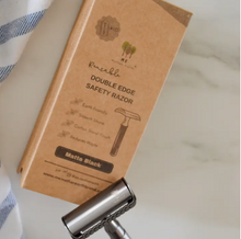 Load image into Gallery viewer, Double edge safety razor with cardboard packaging on a marble surface