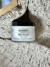 Load image into Gallery viewer, Sea Glass Body Cream nestled in a soft, cream-colored textured blanket beside a gold tray.