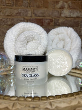 Load image into Gallery viewer, Body cream labeled Mammy's Sea Glass texture and rolled towels on a textured surface