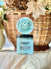 Load image into Gallery viewer, Sea Glass foaming body scrub displayed with warm fall décor.