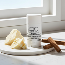 Load image into Gallery viewer, Mammy's Soap Co. natural magnesium deodorant on a marble tray with shea butter and sandalwood sticks, sunlight streaming through a window.