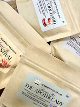 Load image into Gallery viewer, Several kraft paper pouches of Mammy's Soap Co. simmer pots are arranged together, showing labels for The Apothecary, Orchard, Festival, Grandmas
