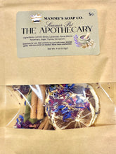 Load image into Gallery viewer, Mammy's Soap Co. Summer Pot 'The Apothecary' herbal pot kit in a kraft paper bag with a clear window showing dried lemon slices, lavender, cinnamon, and other botanicals.