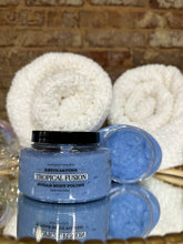 Load image into Gallery viewer, Blue sugar body polish jars with white towels on a textured surface