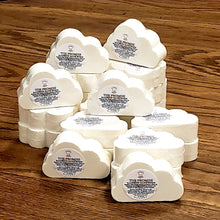 Load image into Gallery viewer, Several stacked cloud shaped bath bombs on a wood table