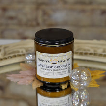 Load image into Gallery viewer, amber glass jar with black lid of apple maple bourbon soy candle