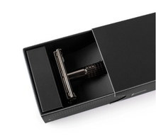 Load image into Gallery viewer, gun metal safety razor in black gift box slid partly open showing top half of razor
