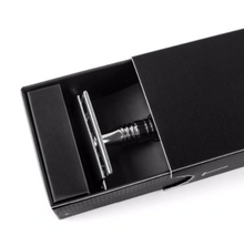 Load image into Gallery viewer, chrome safety razor in black gift box slid partly open showing top half of razor
