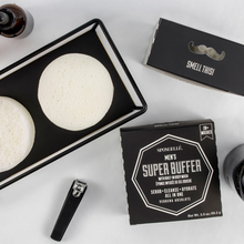 Load image into Gallery viewer, 3 black boxes with white lettering, toenail clippers, amber bottle