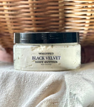 Load image into Gallery viewer, Black Velvet whipped body butter displayed with warm fall décor.

