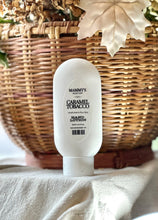 Load image into Gallery viewer, Caramel Tobacco hand lotion displayed with warm fall décor.

