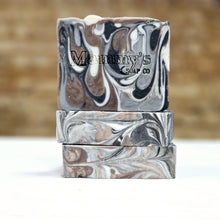 Load image into Gallery viewer, Stack of artisan soap bars with a marbled pattern featuring black, white, and gray colors, branded with 'Mammy's Soap Co.'
