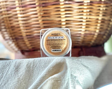 Load image into Gallery viewer, Dulce de Leche lip sugar scrub displayed with warm fall décor.

