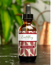 Load image into Gallery viewer, A bottle of Earthley's Sinus Saver remedy with a dropper, featuring a label with red and green leaves design.

