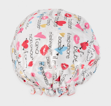Load image into Gallery viewer, A multicolored bouffant shower cap with a pattern of hearts and text, designed to keep hair in place while showering.
