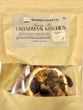 Load image into Gallery viewer, Mammy's Soap Co. Simmer Pot 'Grandma's Kitchen' dried botanical bath soak in a kraft paper pouch with a clear window showing orange slices, cloves, and dried fruit pieces.
