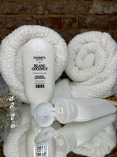 Load image into Gallery viewer, Two white squeeze bottles of hand lotion on a textured surface
