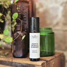 Load image into Gallery viewer, Roll on bottle of Mammy's Soap Co 'Joint &amp; Muscle Support' with a natural background
