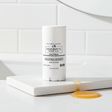 Load image into Gallery viewer, Mammy's Soap Co. Manuka Honey deodorant on a white surface with a tiled wall background
