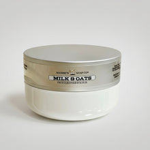 Load image into Gallery viewer, White jar with silver lid on a reflective surface
