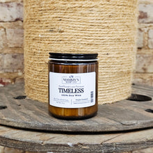 Load image into Gallery viewer, Amber candle with a Mammy's Soap Co Timeless Soy Wax label on a wooden surface and jute background
