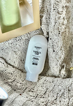 Load image into Gallery viewer, Vanilla Oak hand lotion displayed on a cozy textured blanket.

