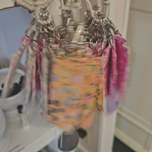 Load and play video in Gallery viewer, Spinning of many lip balm holders on a rotating display.
