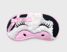 Load image into Gallery viewer, Black and white cow face sleep mask with eyelashes and a pink bow on a light gray background
