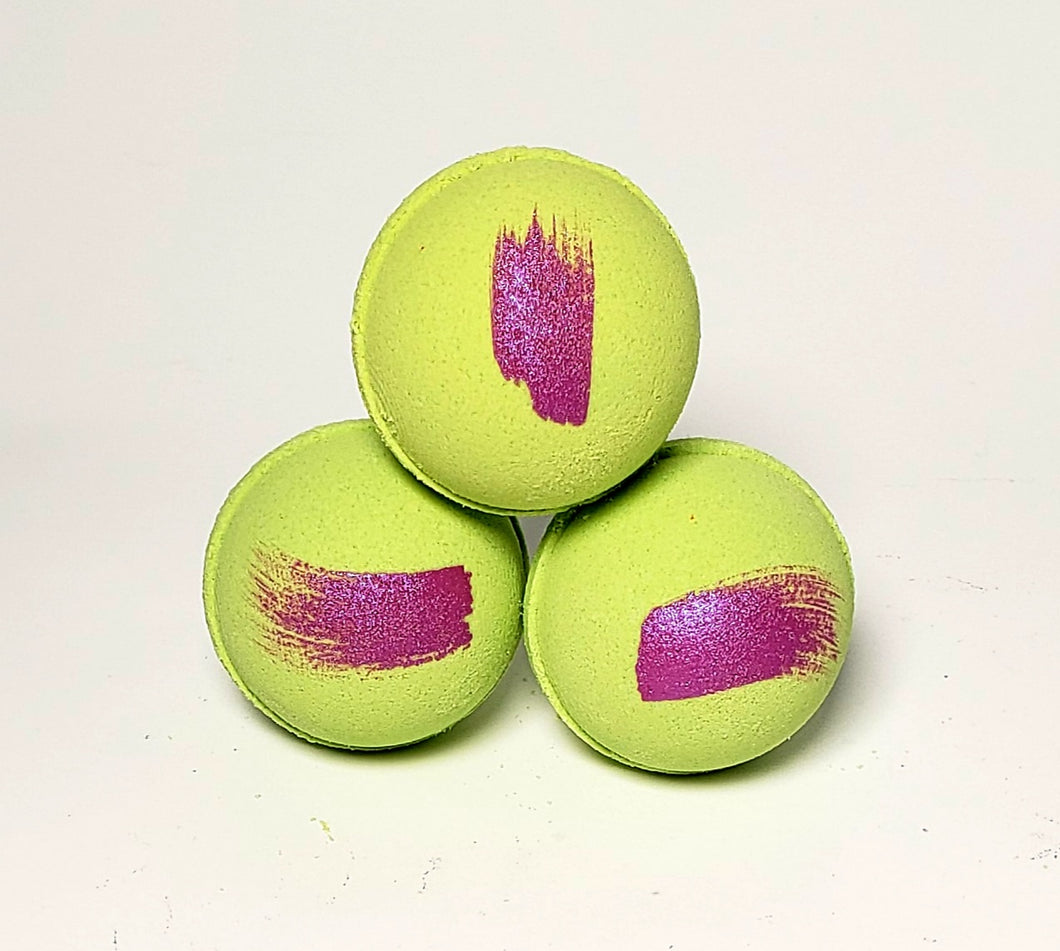lime green bath bomb with purple stripe scented with grape, rose and jasmine