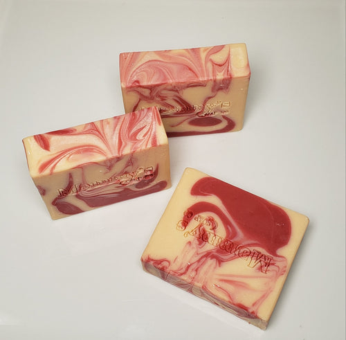 three bars of red and cream handcrafted goat milk bar soap stamped Mammy's Soap Co
