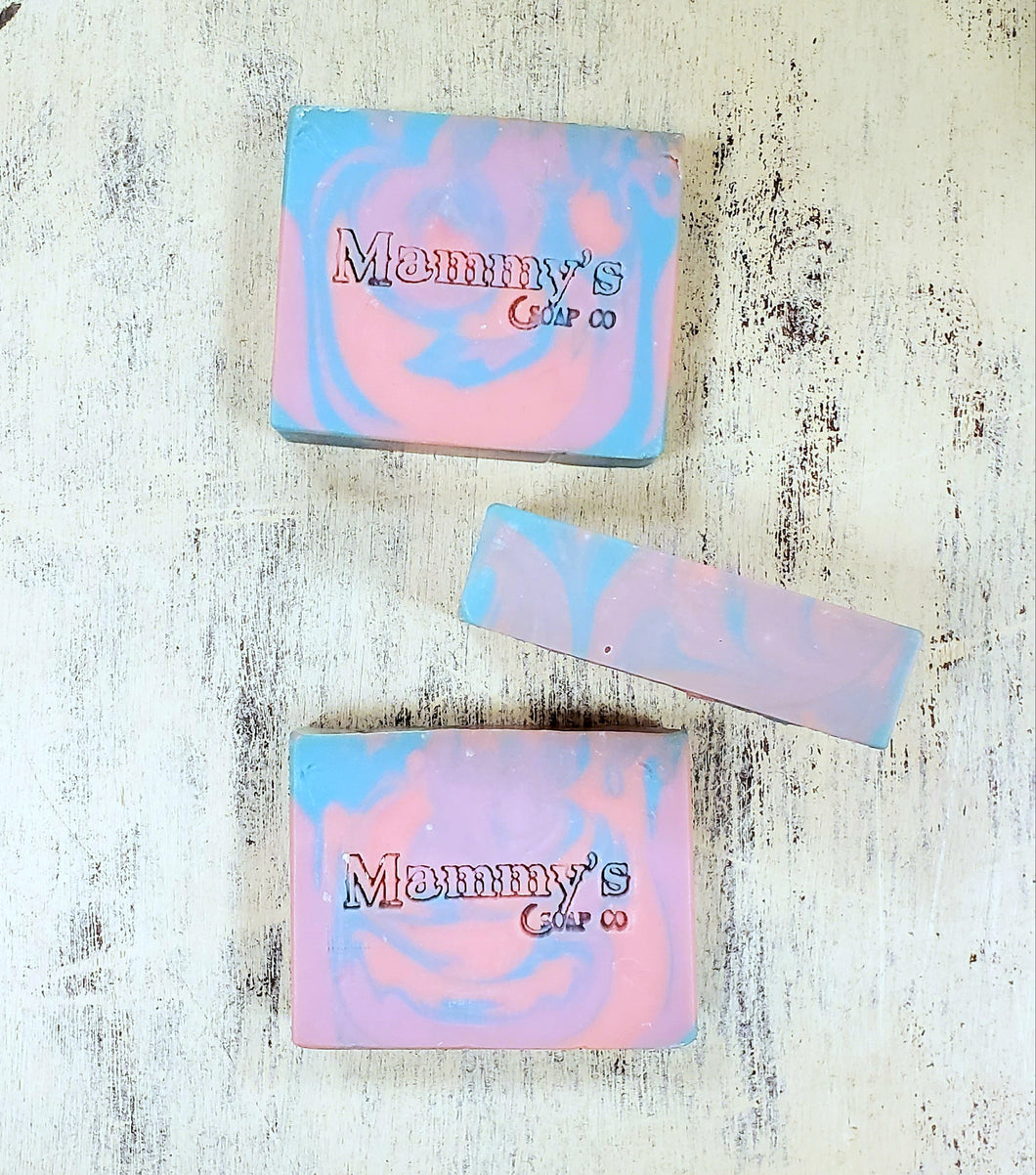 3 bars of handmade soap in colors of pink, blue and purple scented in cotton candy called Carnival