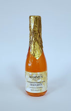 Load image into Gallery viewer, Champagne bottle filled with orange bubble bath topped with gold foil over cap.
