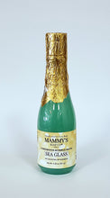 Load image into Gallery viewer, Champagne bottle filled with sea green colored bubble bath topped with gold foil over cap.
