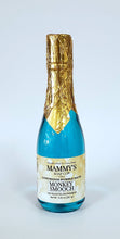 Load image into Gallery viewer, Champagne bottle filled with blue colored bubble bath topped with gold foil over cap.
