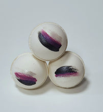 Load image into Gallery viewer, 3 white bath bombs with navy, purple &amp; silver stripes stacked in a pyramid
