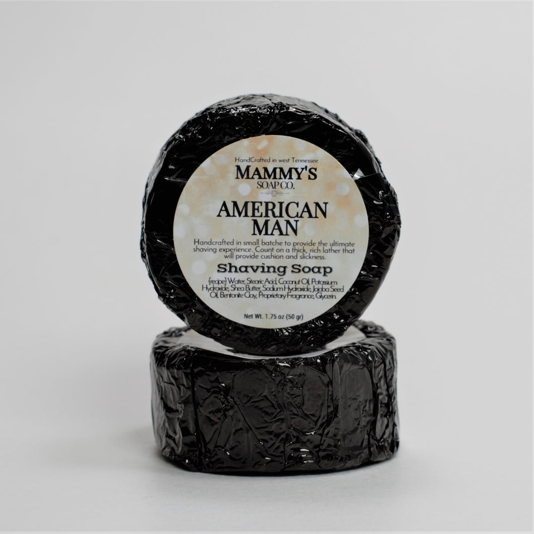 two American man stacked handmade shaving soap pucks wrapped in black foil with label