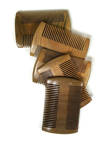 Many displayed natural double sided sandalwood beard combs one side with fine teeth and the other side with coarse teeth