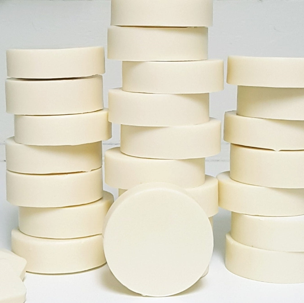 three stacks of several round bars of baby soap
