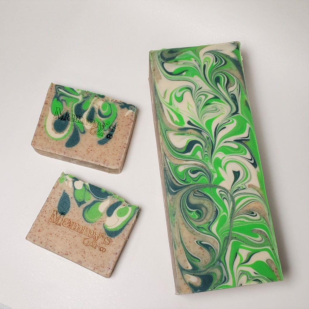 partial loaf and 2 bars of tan white and tri color green handcrafted bar soap stamped Mammy's Soap Co