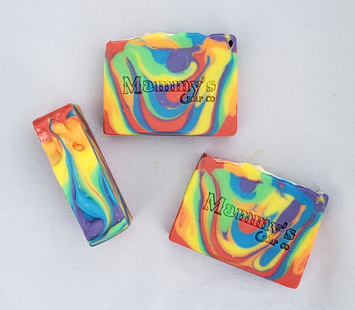 three bars of rainbow striped handcrafted bar soap stamped Mammy's Soap Co