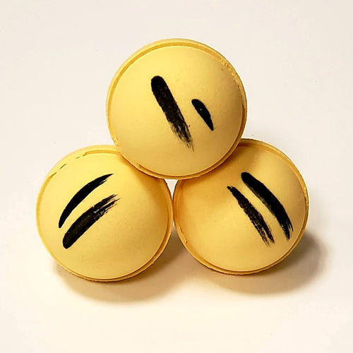 3 yellow bath bombs with 2 black stripes