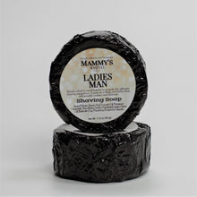 Load image into Gallery viewer, two ladies man stacked handmade shaving soap pucks wrapped in black foil with label
