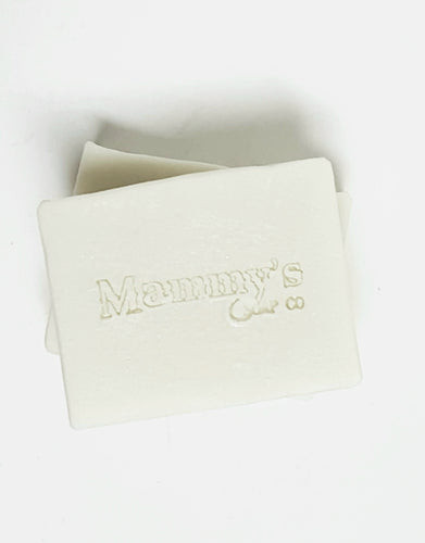 two stacked white bars of soap stamped Mammy's Soap Co