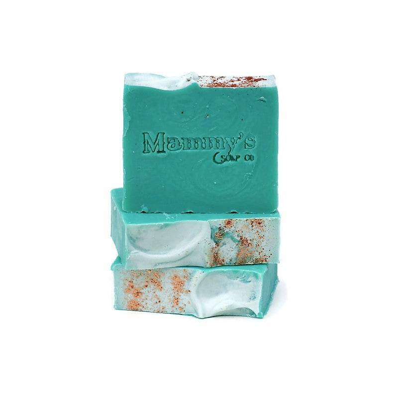 3 turquoise soap bars stacked with glitter on top