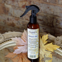 Load image into Gallery viewer, amber spray bottle of sweet fig body oil with fall background
